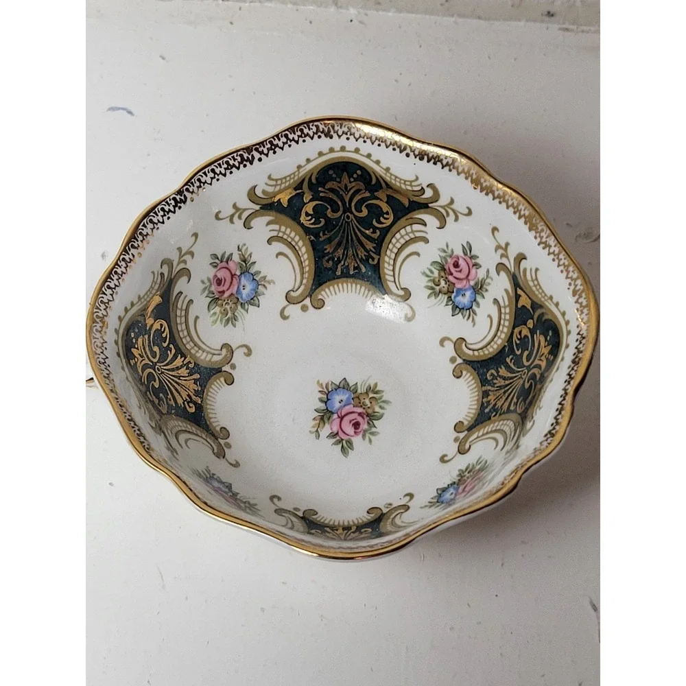 Paragon teacup - dark green panels on white background with floral‎ decor...Read